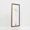 Efecto marco de madera maciza perfil 22 marrón-oro 21x29,7 cm cristal antirreflejos